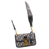 Blue Dior monogram flap crossbody bag with shoulder strap and gold-tone lock