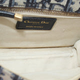 Logo patch inside flap crossbody bag lining with gold zipper pull
