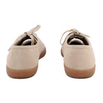 Beige suede sneakers rear view with heel tab and lace-up closure