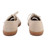 Beige suede sneakers rear view with heel tab and lace-up closure