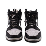 Pair of black and white high-top sneakers with perforated toe and lace-up