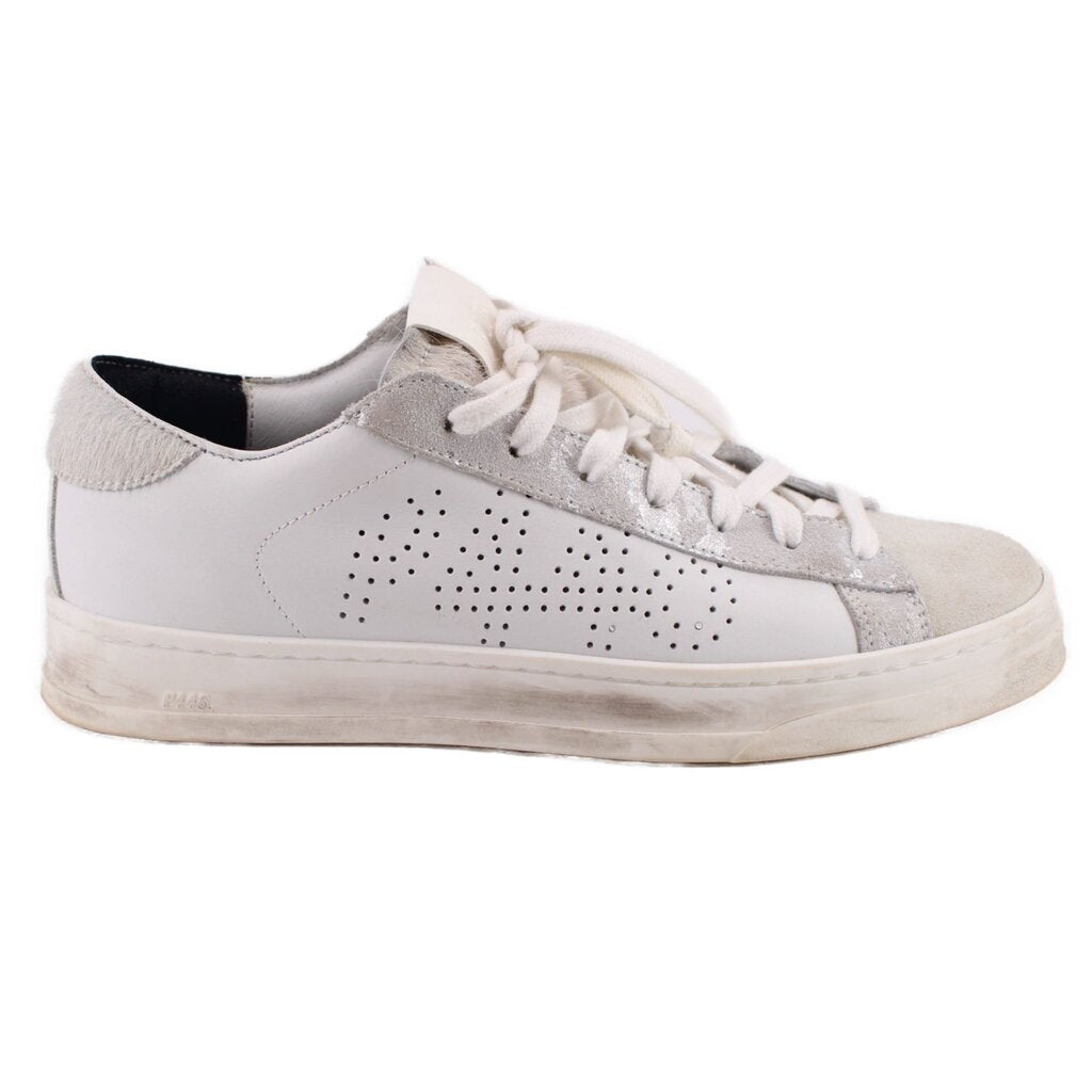 White leather sneakers, lace-up style with perforated quarter and padded tongue