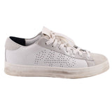 White leather sneakers, lace-up style with perforated quarter and padded tongue