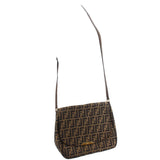 Zucca flap crossbody bag on shoulder, tobacco FF pattern with adjustable strap