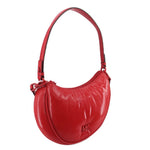 Red curved shoulder bag with adjustable strap and small top zip pocket