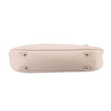 Cream bamboo shoulder bag bottom view with four gold-tone feet