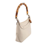 Cream bamboo shoulder bag, side view with curved handle and small metal hardware
