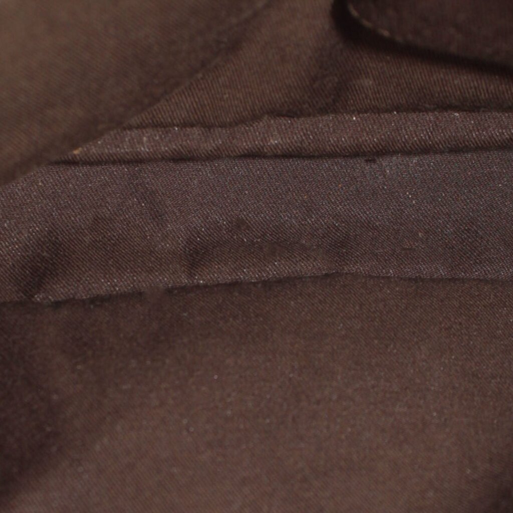 Dark fabric interior lining of cream Gucci bamboo shoulder bag, close-up