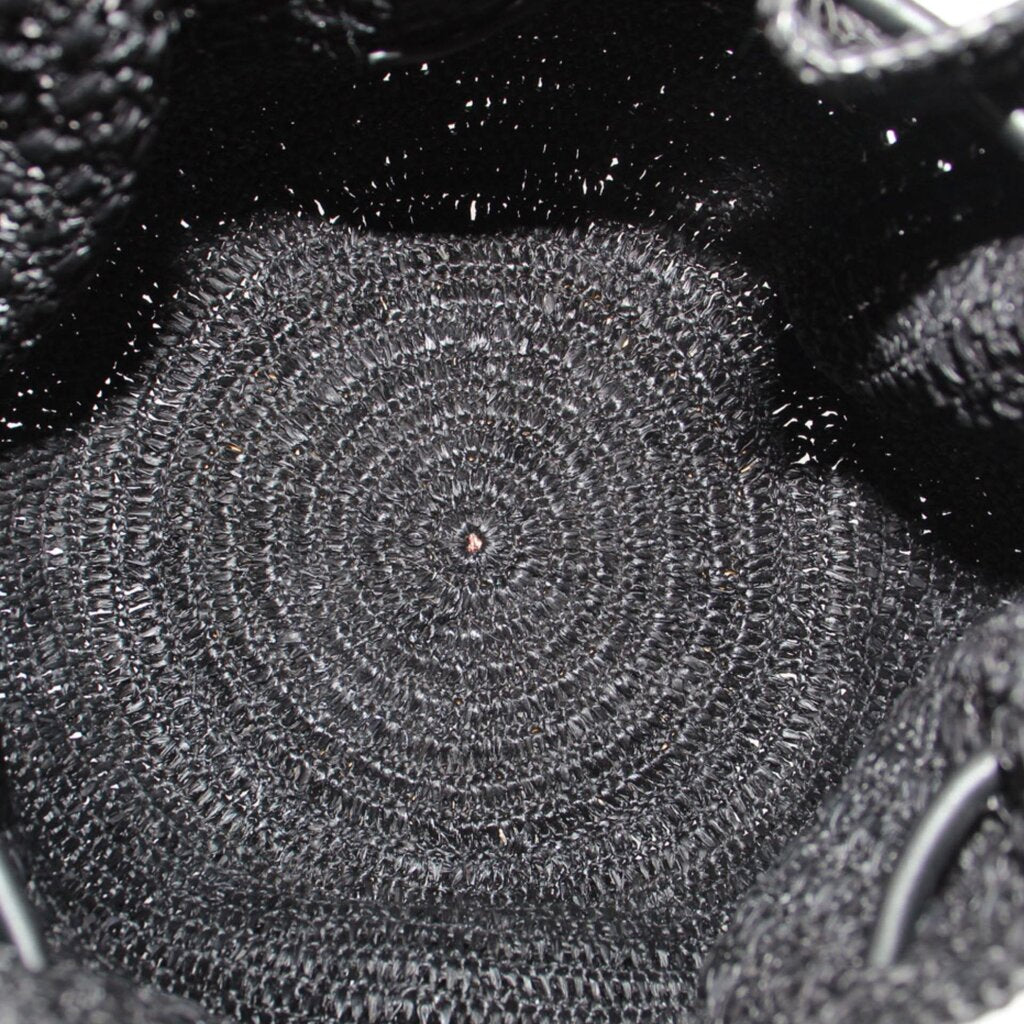 Black raffia woven texture on bucket bag