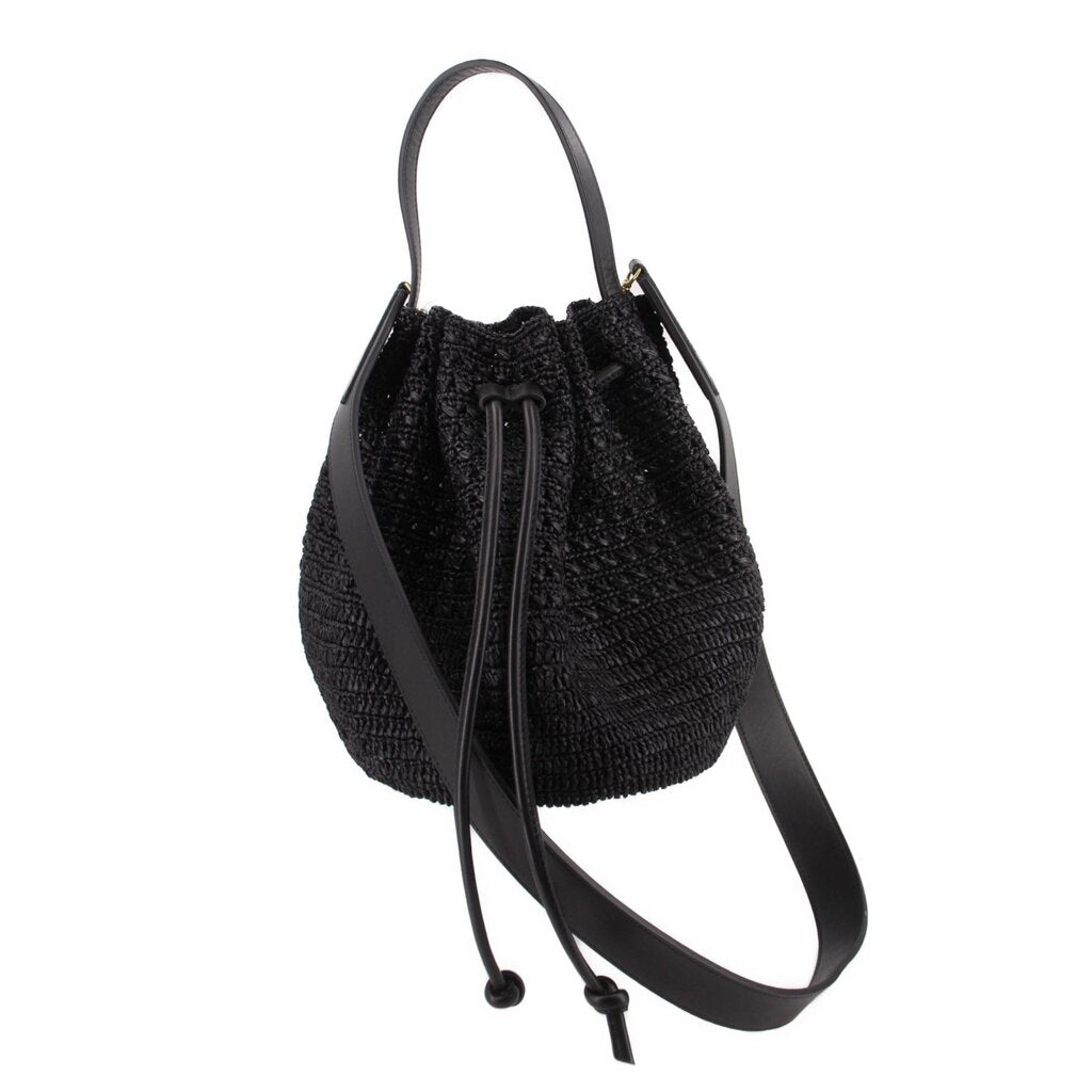 Black raffia crossbody bucket bag with drawstring top and black leather strap