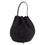Black raffia bucket crossbody bag with drawstring closure and top handles