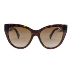 Tortoise cat-eye sunglasses with tinted lenses and Gucci logo on the temple
