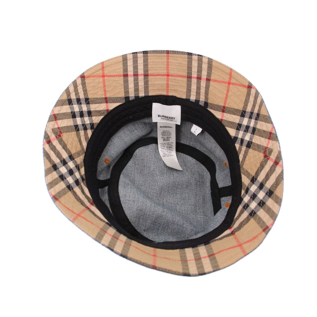 Denim bucket hat interior with beige check lining and gray inner band