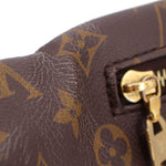 Close-up of monogram bumbag strap hardware with gold-tone buckle
