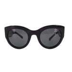 Black cat-eye sunglasses with dark lenses and glossy black frame