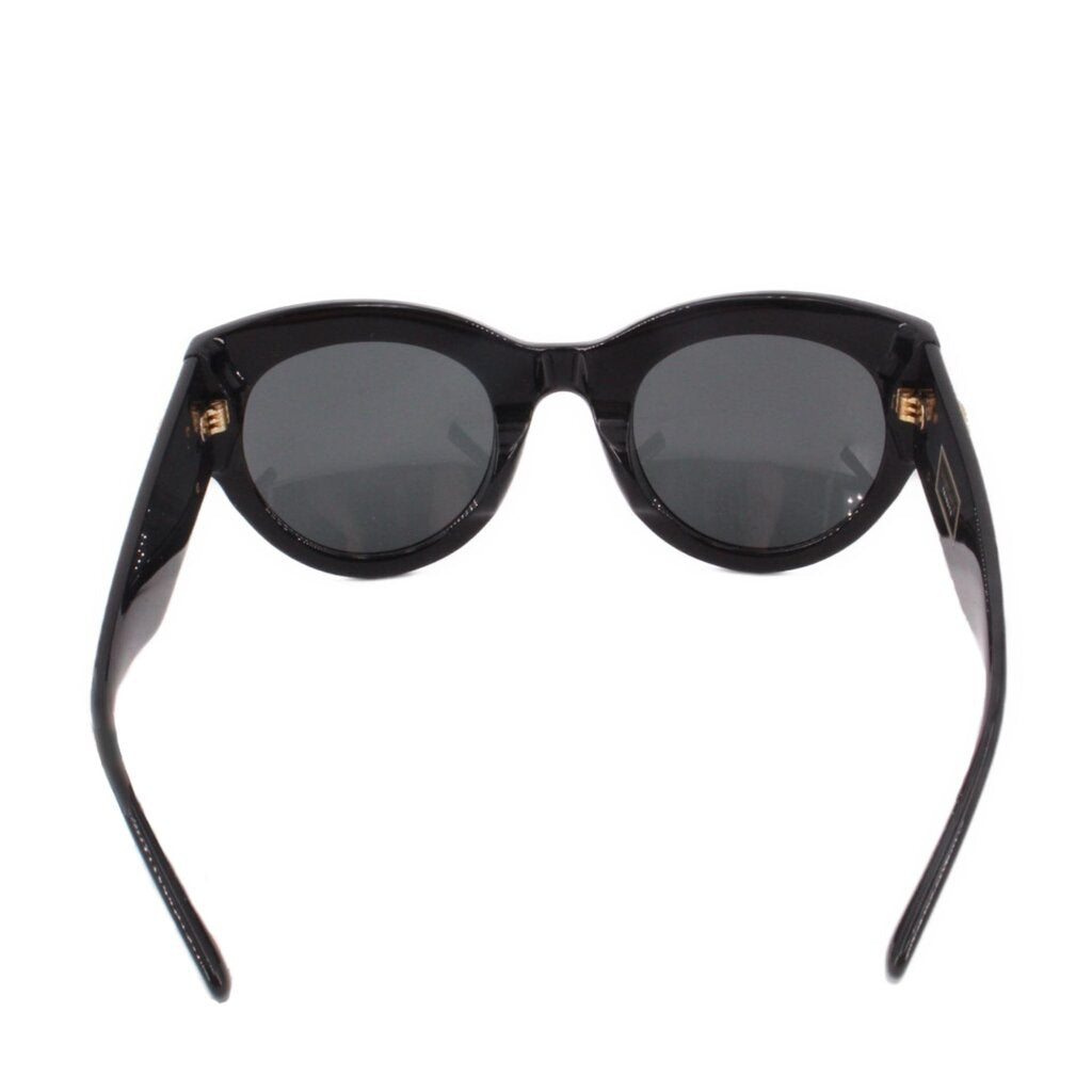 Black sunglasses front view with rounded cat-eye frames and dark lenses