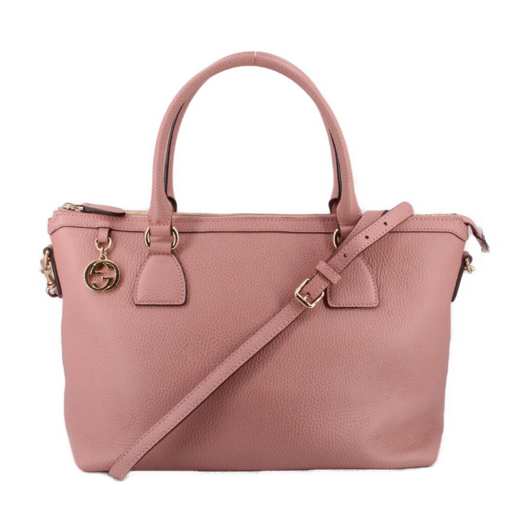 Blush leather zip-top satchel with top handles and front logo charm