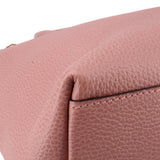 Close-up of blush leather edge with stitching on zip-top satchel