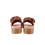 Brown woven sandals with adjustable straps and cushioned low platform heel