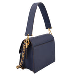 Navy small crossbody bag with structured sides, front flap, and gold ring hardware