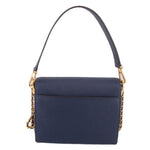Navy mini crossbody bag with long strap, flap front and gold-tone logo medallion