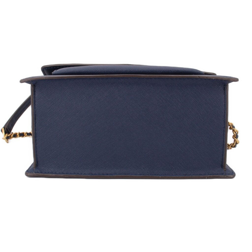 Navy crossbody bag underside view with structured base and flap edge