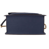 Navy crossbody bag underside view with structured base and flap edge