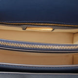 Navy bag interior view with zip closure and fabric lining