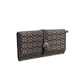 Black signature wallet foldover flap with center D-ring and snap closure
