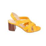 Yellow heeled sandals with crisscross straps and chunky wooden-style block heel