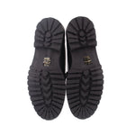 Black loafer outsoles with zigzag tread pattern and MAEVE branding