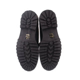 Black loafer outsoles with zigzag tread pattern and MAEVE branding