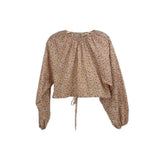 Orange floral blouse with long balloon sleeves, gathered neckline, tie-front waist