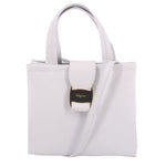 White leather crossbody tote with top handles and front logo tab detail