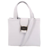 White leather crossbody tote with top handles and front logo tab detail