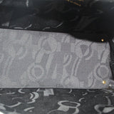 Inside lining of white leather crossbody tote with patterned logo print