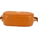 Orange Kira camera crossbody bag back view with smooth leather and top zip closure