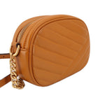 Orange Kira crossbody bag angled view with zip opening and chain shoulder strap
