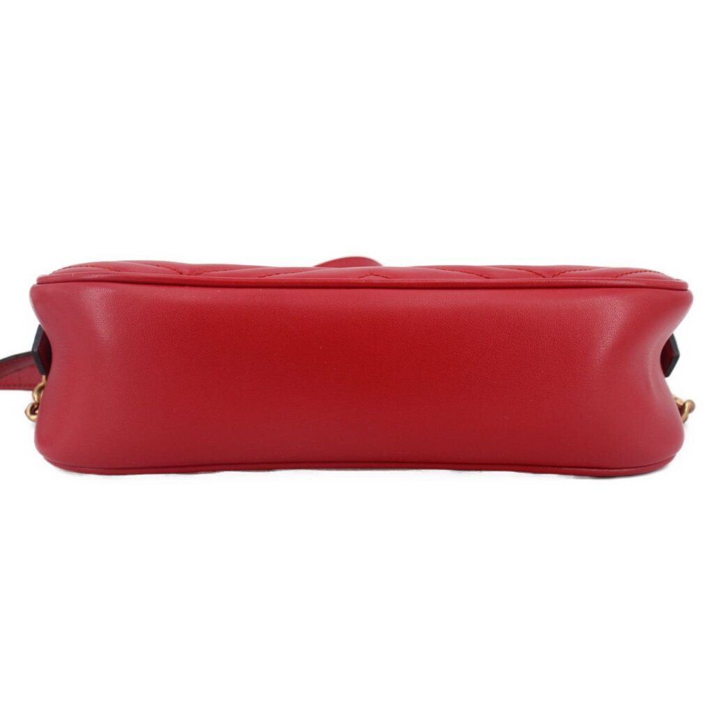 Red leather camera crossbody bag, back view with smooth base and stitched edge