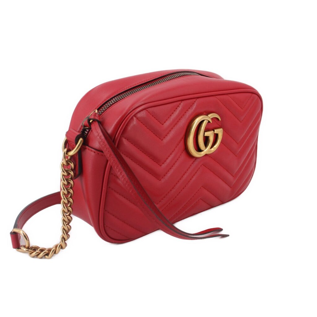 Red quilted leather camera crossbody bag, side view with gold-tone GG emblem