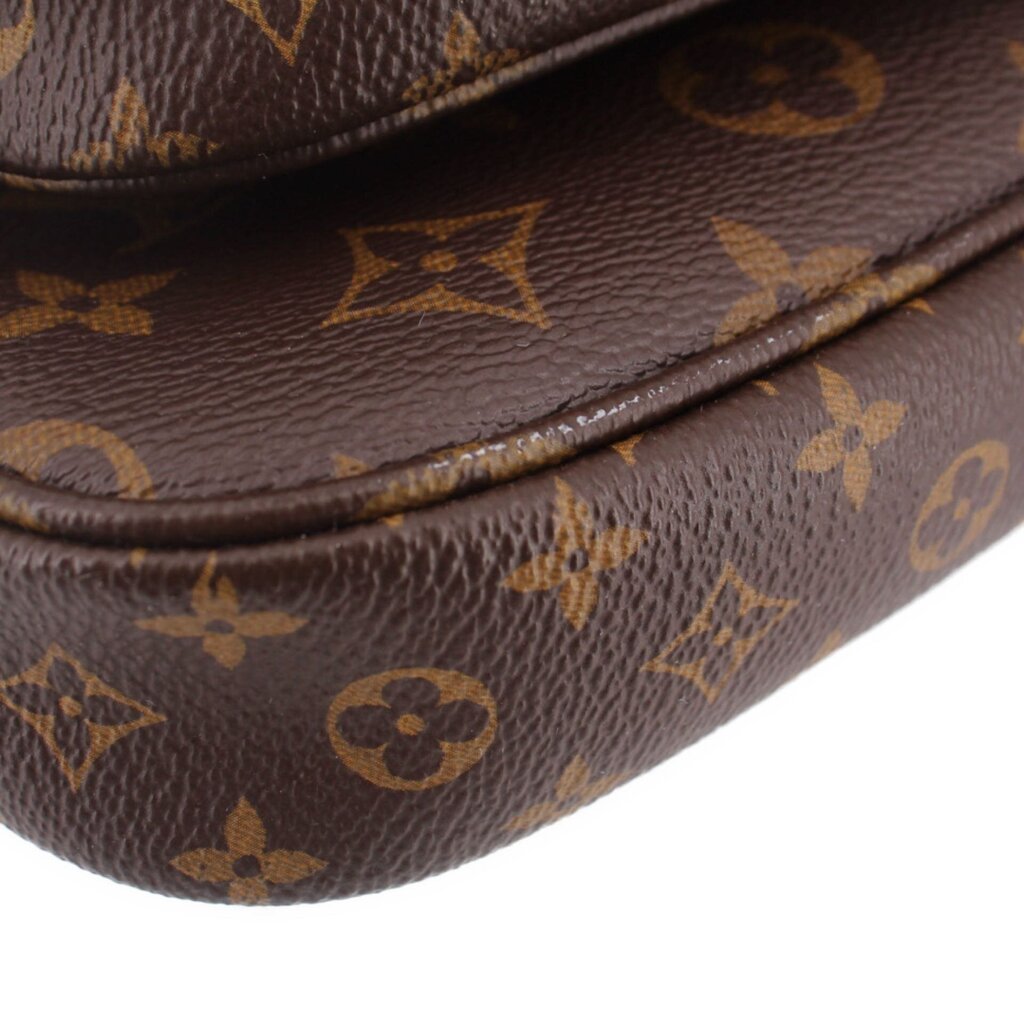 Close-up of brown monogram leather fold with stitched piping along pouch edge