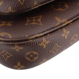 Close-up of brown monogram leather fold with stitched piping along pouch edge