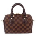 Damier Ebene Speedy crossbody bag front view with leather trim and top handles