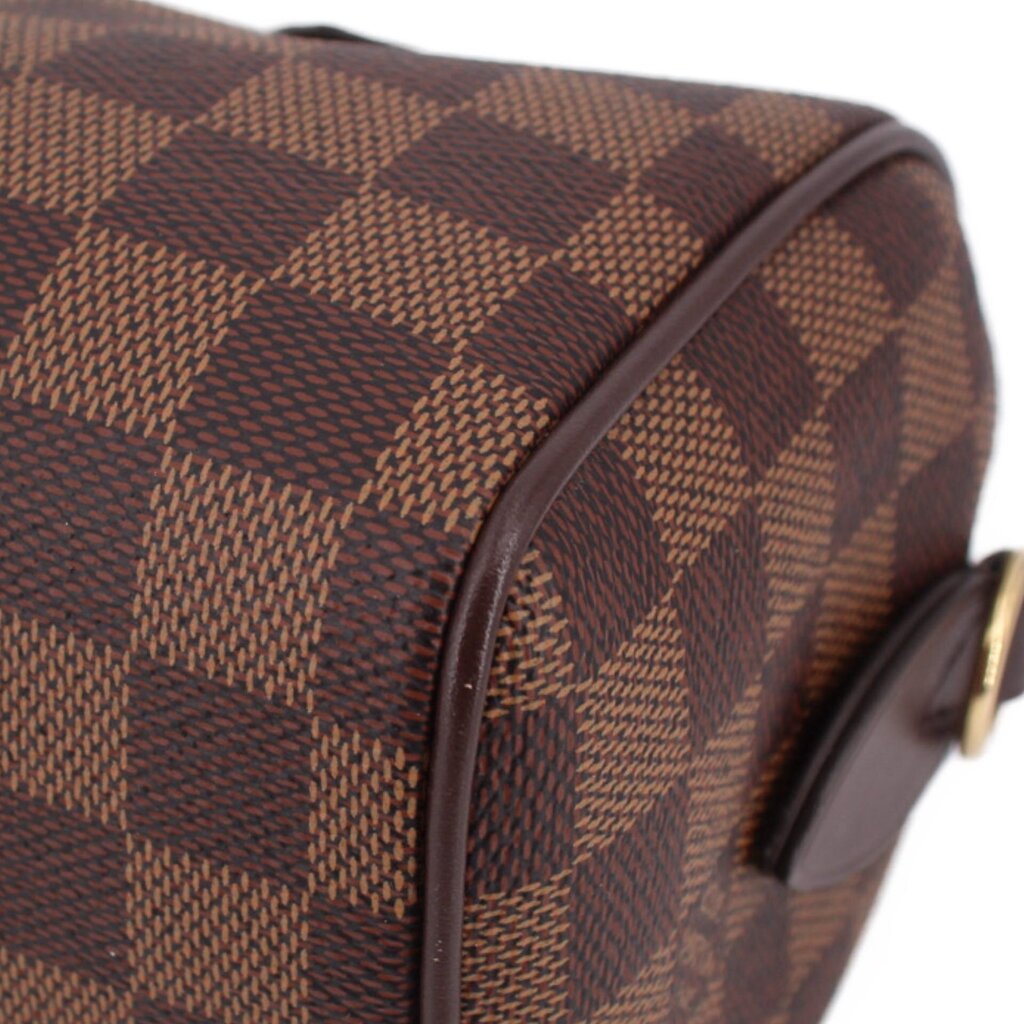 Damier Ebene crossbody bag side panel close-up with patterned canvas