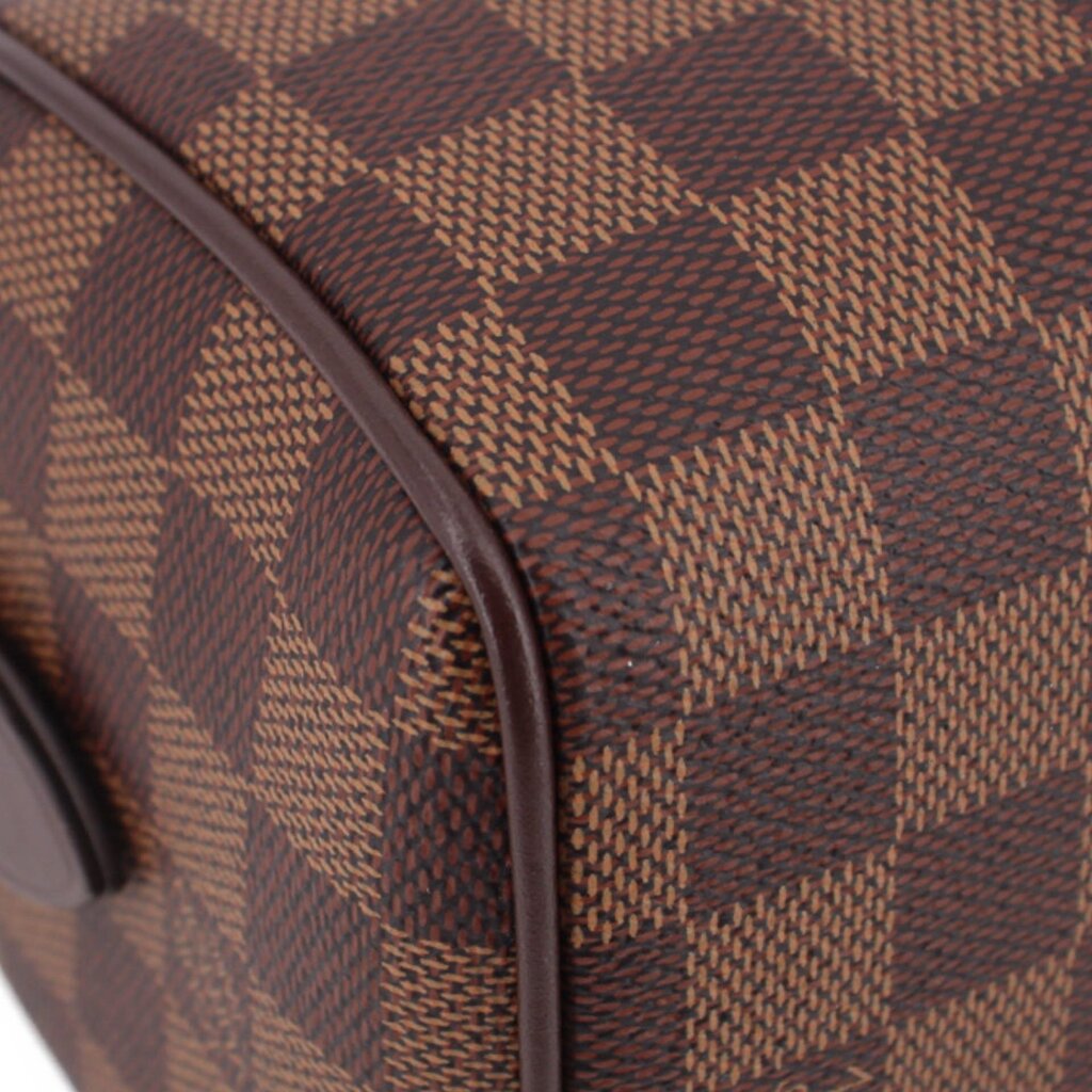 Damier Ebene crossbody bag corner close-up with leather trim edge