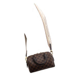 Damier Ebene crossbody bag with strap, small front pocket, and gold-tone hardware