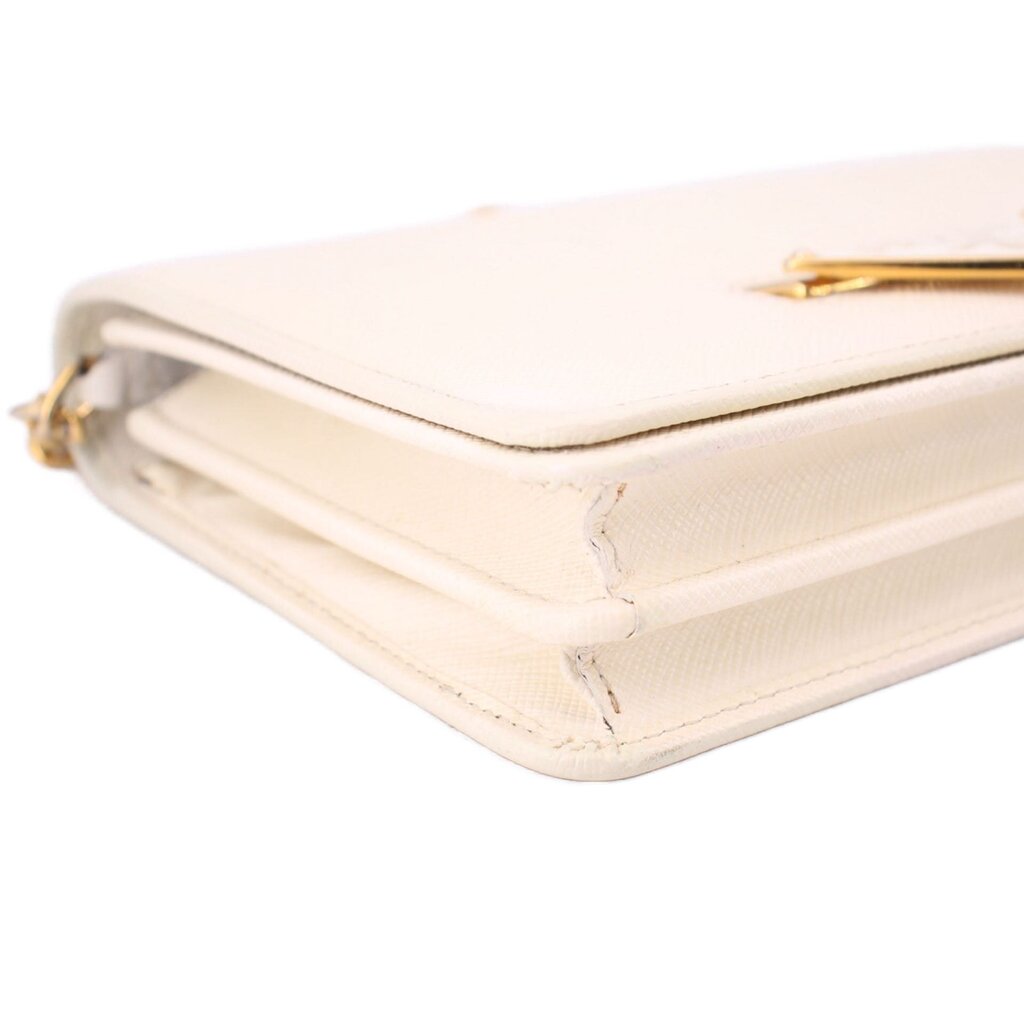 Cream Saffiano leather corner detail with gold-tone hardware and stitching
