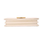 Cream Saffiano crossbody bag underside view with gold-tone clasp hardware