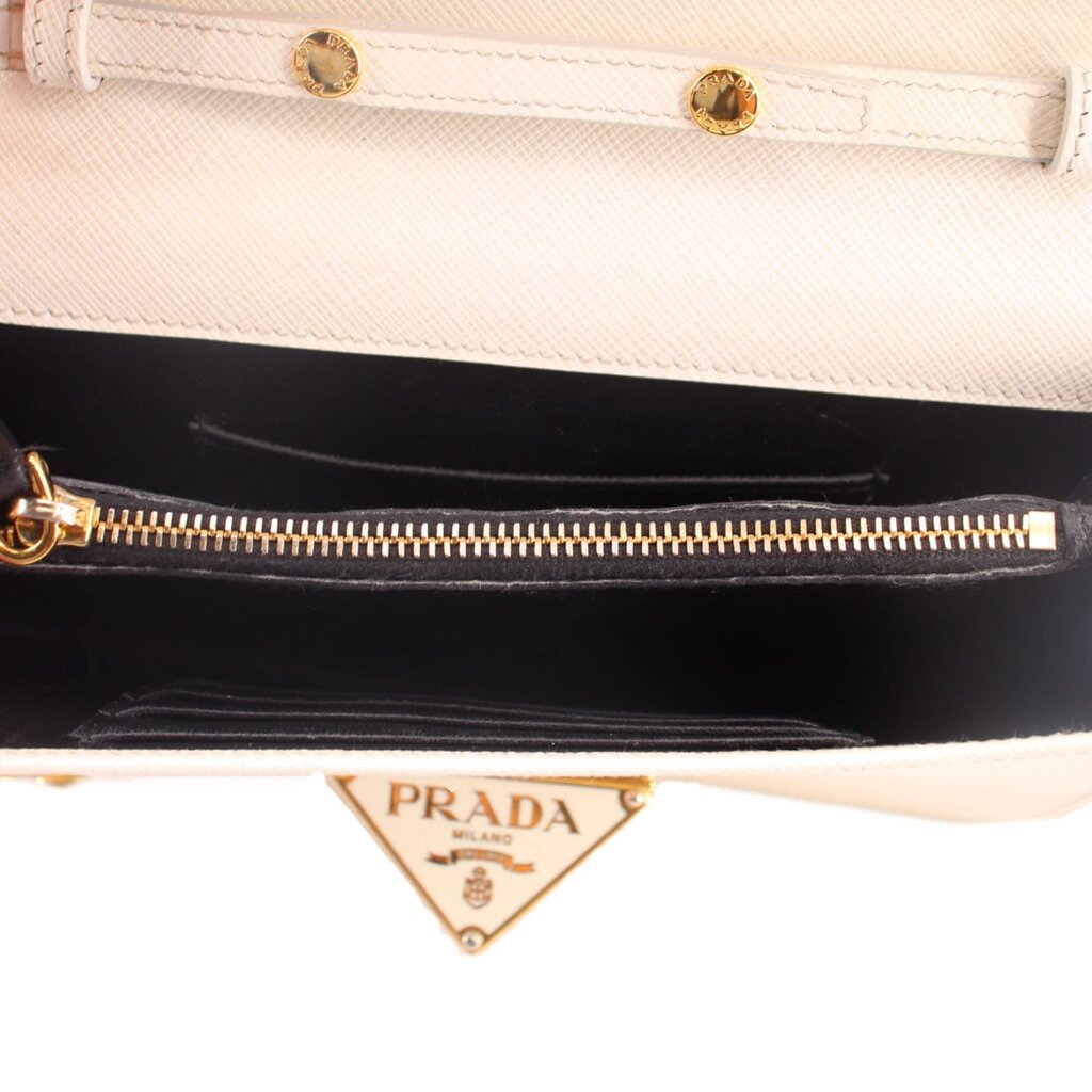 Cream Saffiano bag interior with black lining and gold zipper