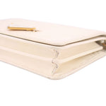 Cream Saffiano corner close-up with gold-tone clasp near opening seam
